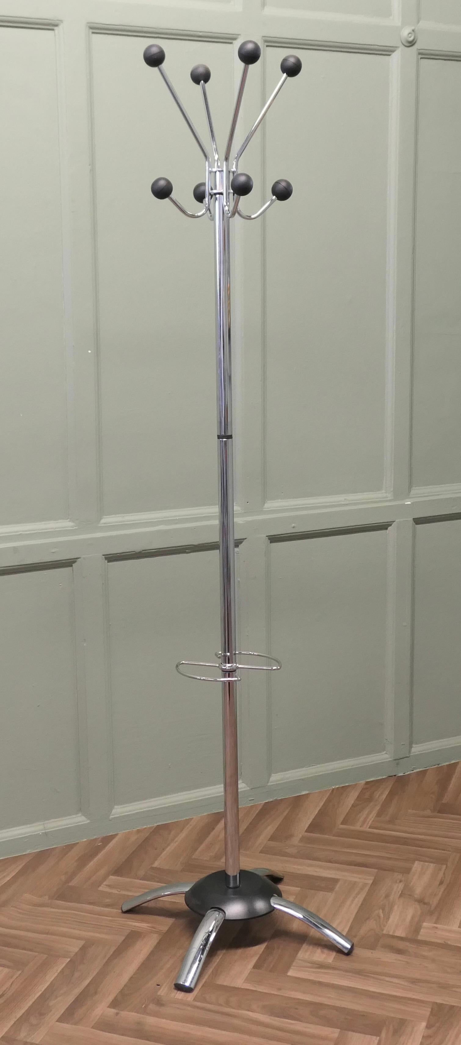 A Mid Century Modern Sputnik Style Hall Stand

This is a very stylish Hat Coat & Umbrella Hall Stand, it has 4 Sputnik topped curving double hat and coat pegs at the top and an slimline umbrella stand at the centre
The Hall Stand is in Good