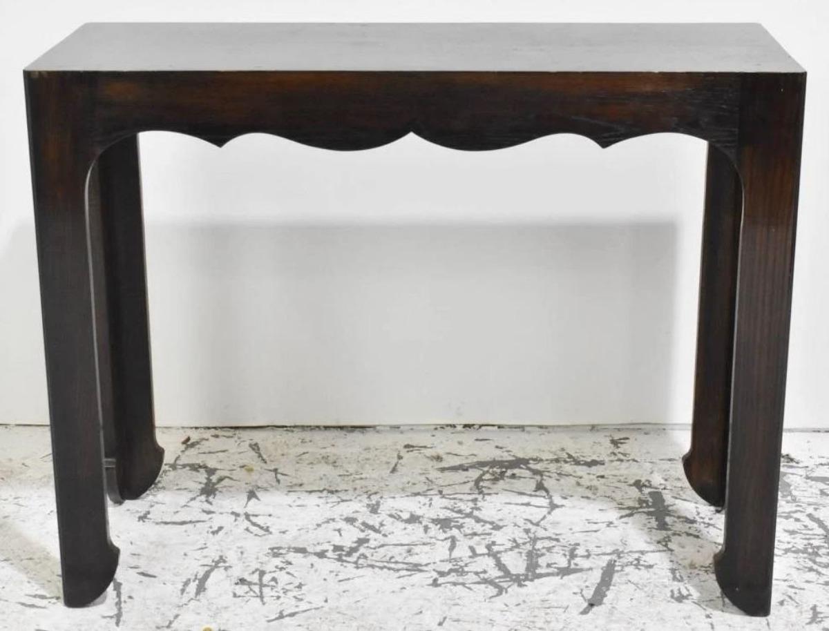 A mid century modern style console with Oriental inspired details. 