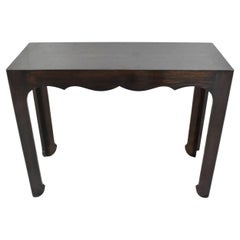 A mid century modern style console with  Oriental inspired details.