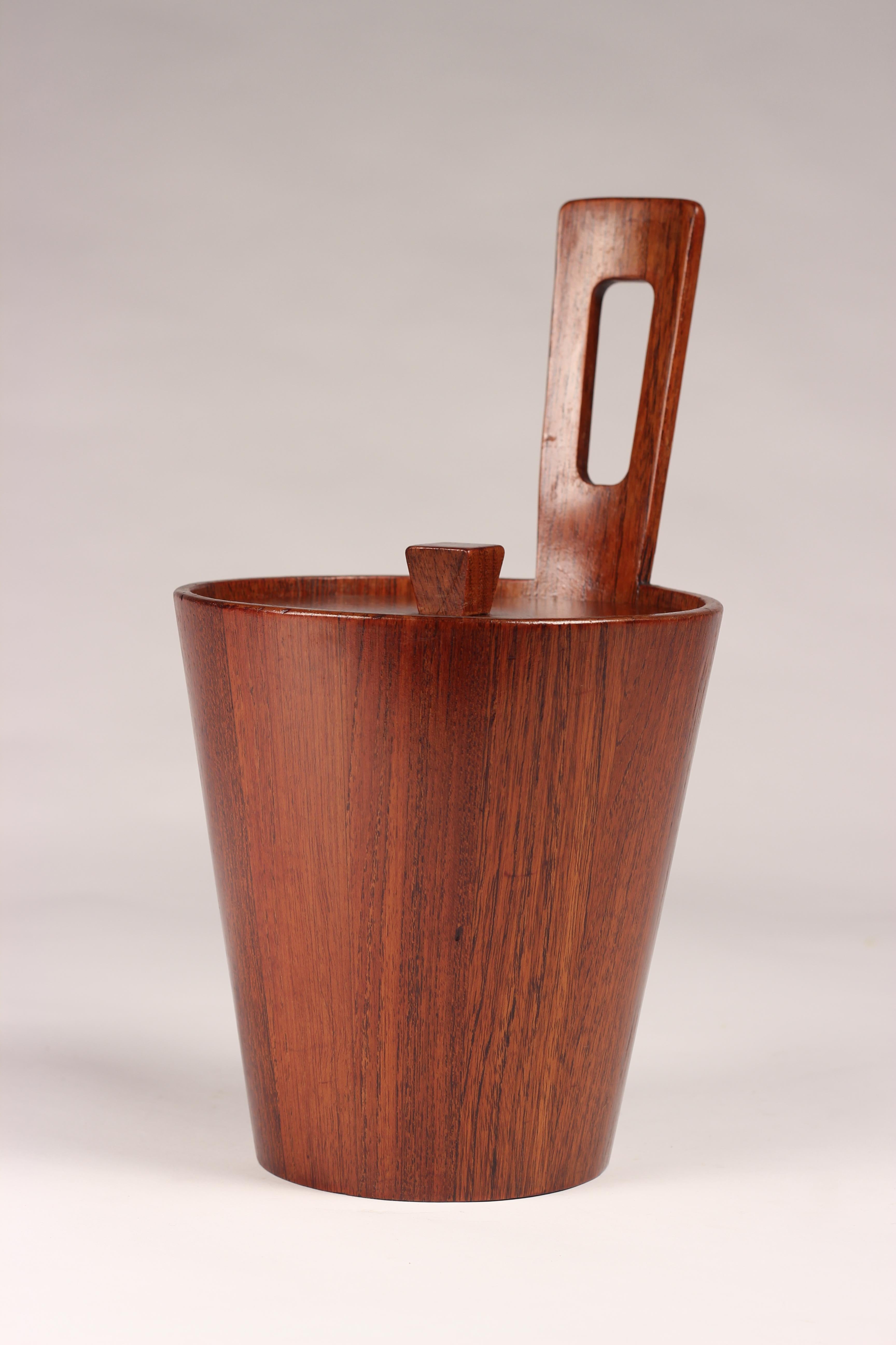 A midcentury teak ice bucket in the style of Jens Quistgaard. This piece is one of a collection we have collected and restored by the Italian Maker Arni Form. Stamped to the base with the original copper mark and logo.
 