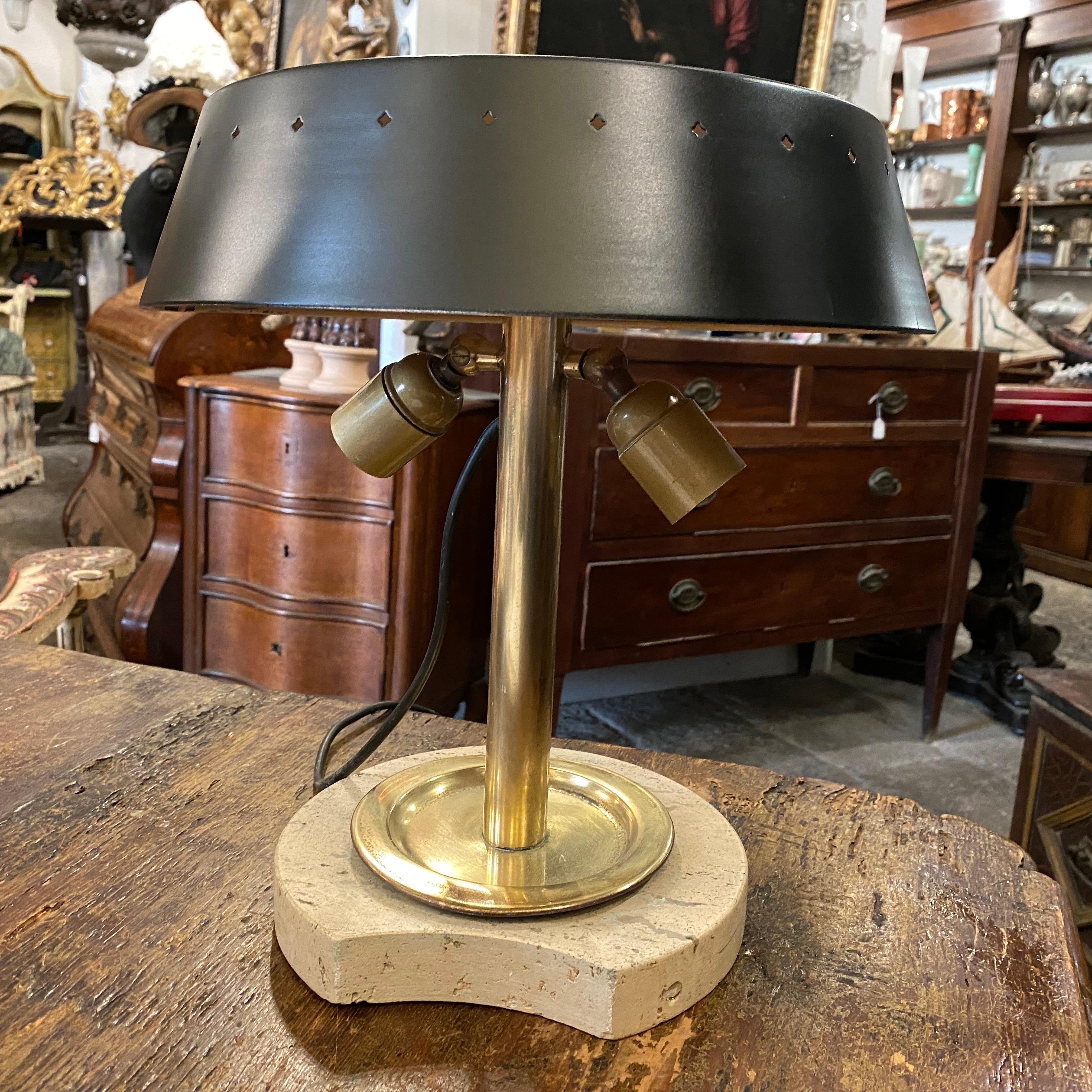 It's an high quality two lights table lamp designed and manufactured in Italy in the Sixties, it works both 110-240 volts and need two regular e27 bulbs.
This table lamp is a visually striking and sophisticated piece, blending natural materials with