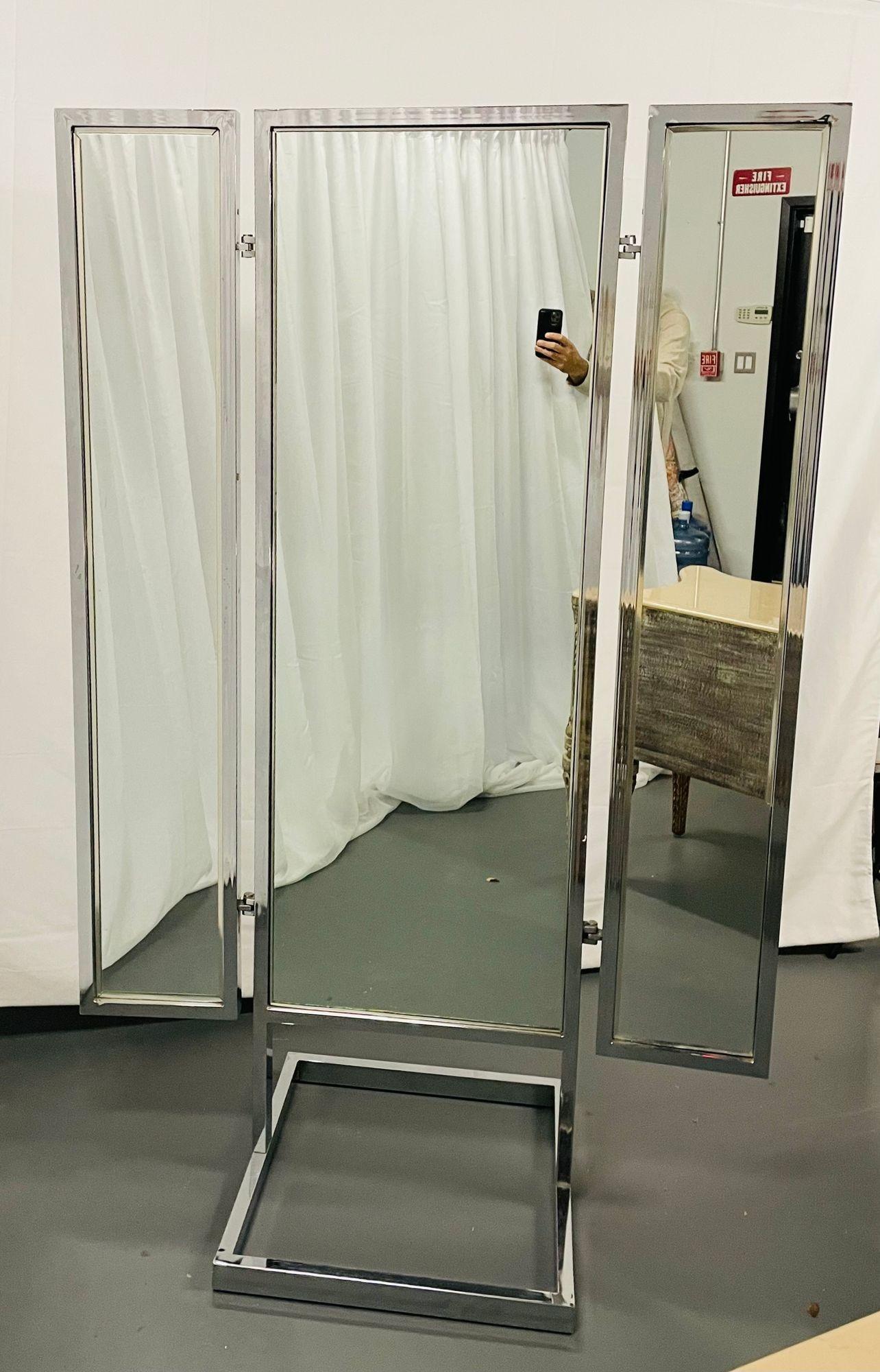 A Mid Century Modern Trifold Cheval Mirror, Steel and Chrome Framed, Reversable
 
A Standing Tri fold Mirror that is finished on all sides making this rare and highly functional mirror capable of standing in the center of your home or clothing