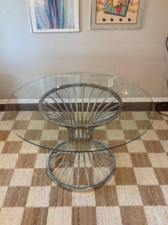 A mid century modern tulip chrome dining set circa 1970s