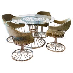 A mid century modern tulip chrome dining set circa 1970s