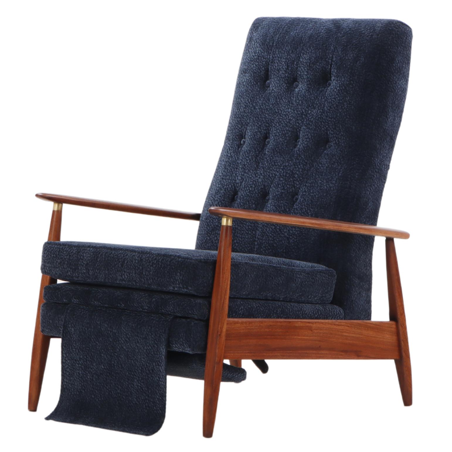 A mid century modern upholstered Milo Baughman model #74 walnut reclining chair.