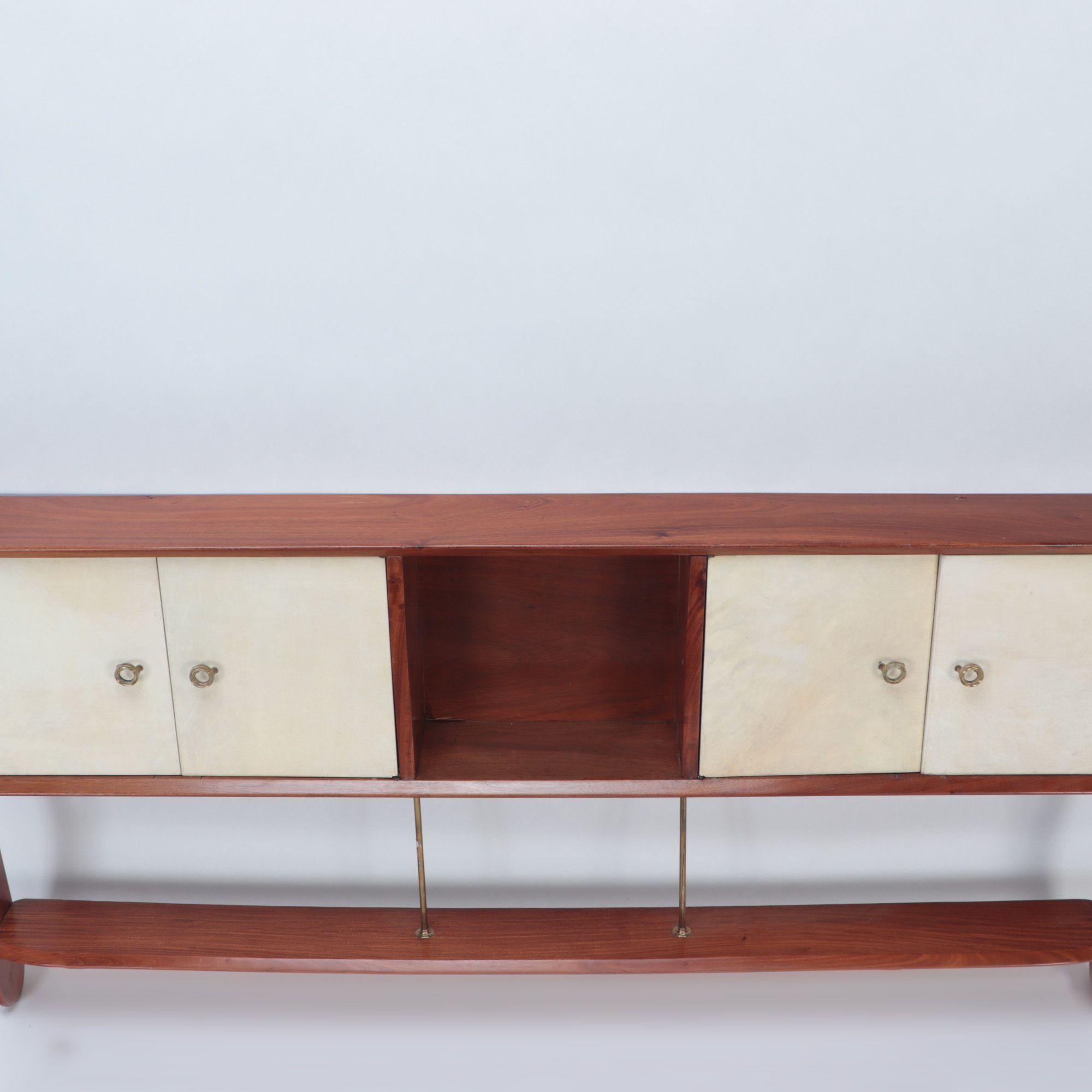 A Mid-Century Modern walnut wall hung head board. Two sets of parchment doors with brass details, circa 1960.