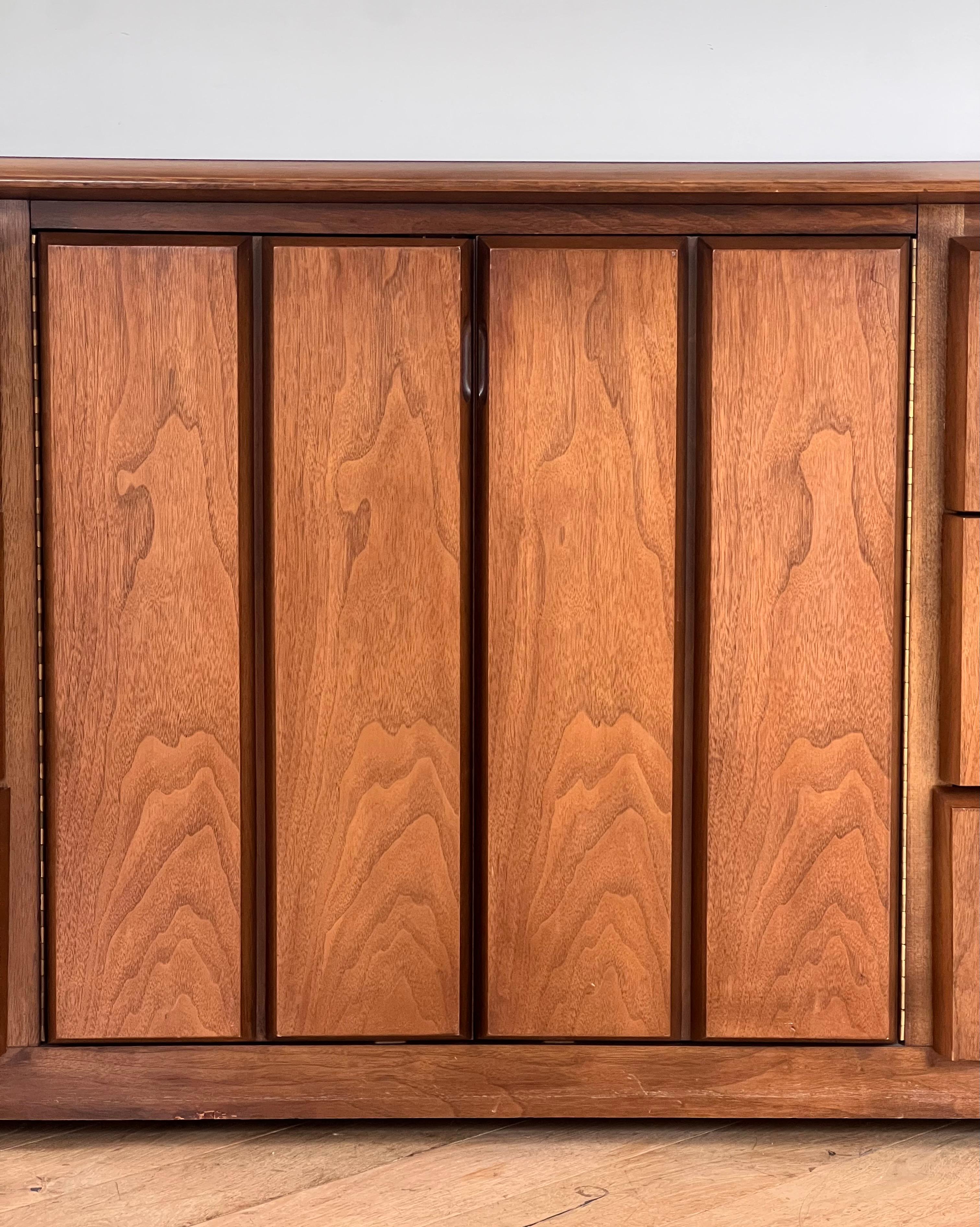 A mid century modern walnut wood nine-door dresser / sideboard, circa 1960 1