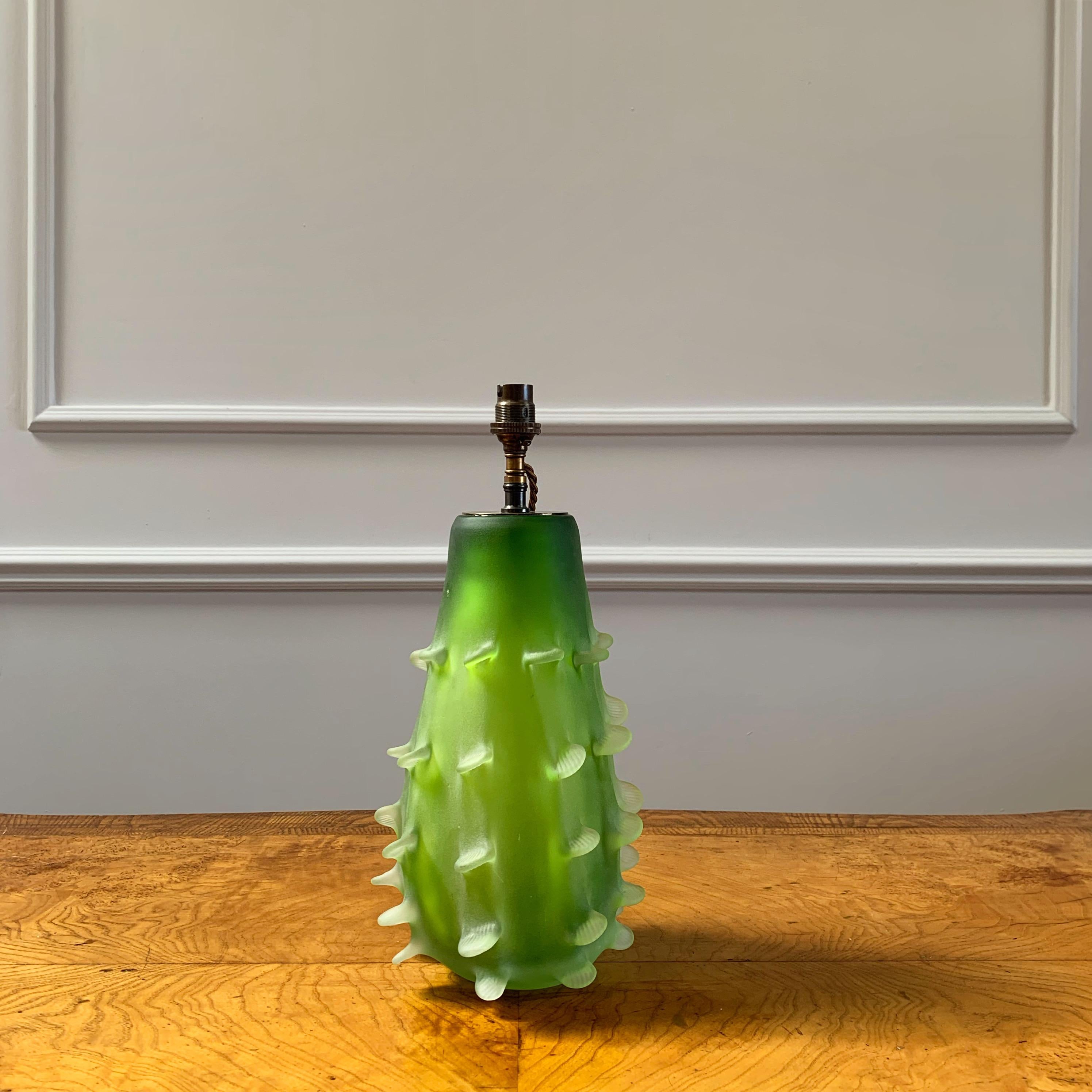 A mid-century green Murano glass vase, in the form of a cactus, with protruding fins, now converted as a lamp.

Italian, Mid Twentieth Century

H (to top of vase)  30 x W 11 cm