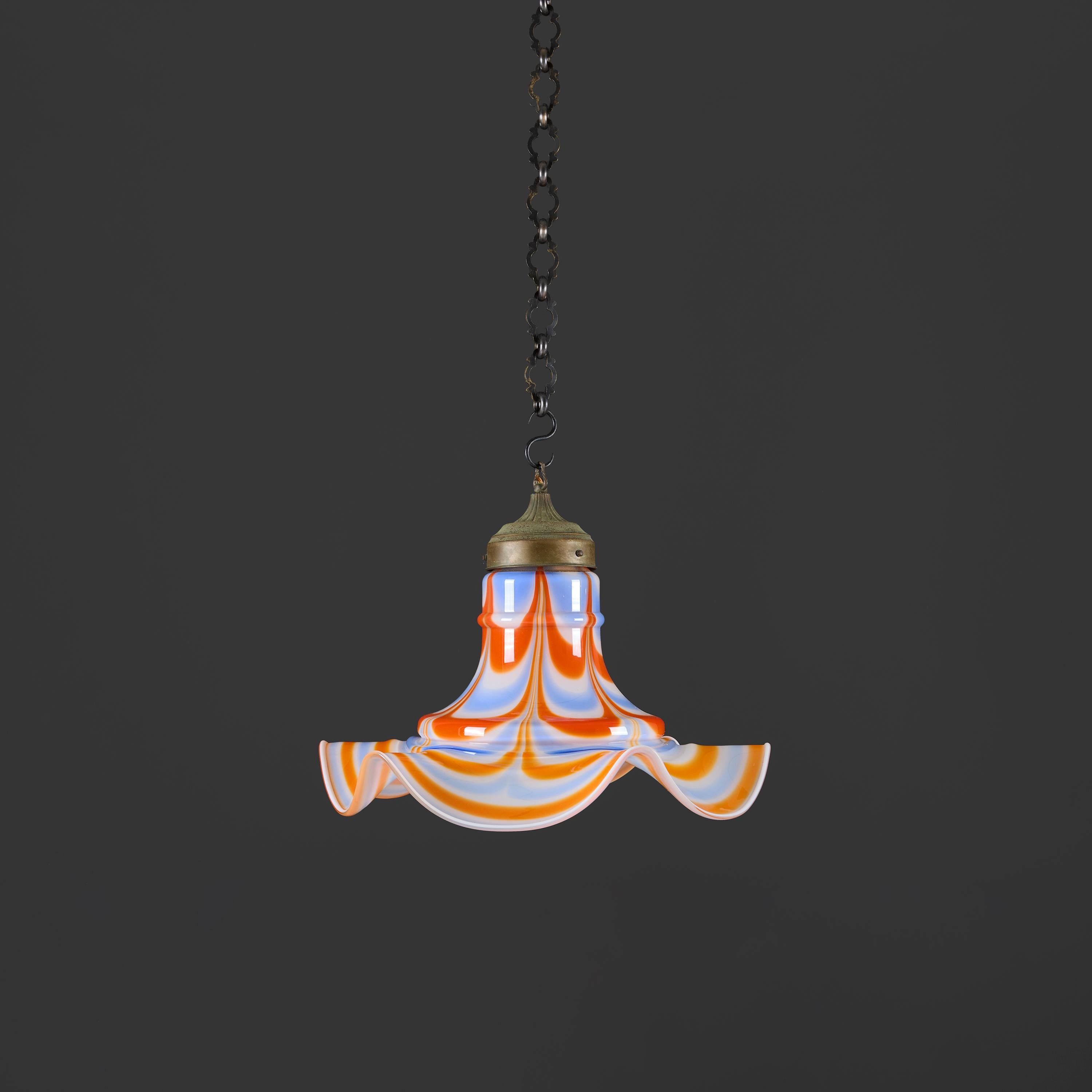 Italy, circa 1950

An unusual midcentury Murano glass hanging light with crinkle edge, in orange blue and white tricolore colour waves. 

Height of pendant   38.00cm

Diameter   47.00cm

Please note:

To include wiring. 

Chain not included.