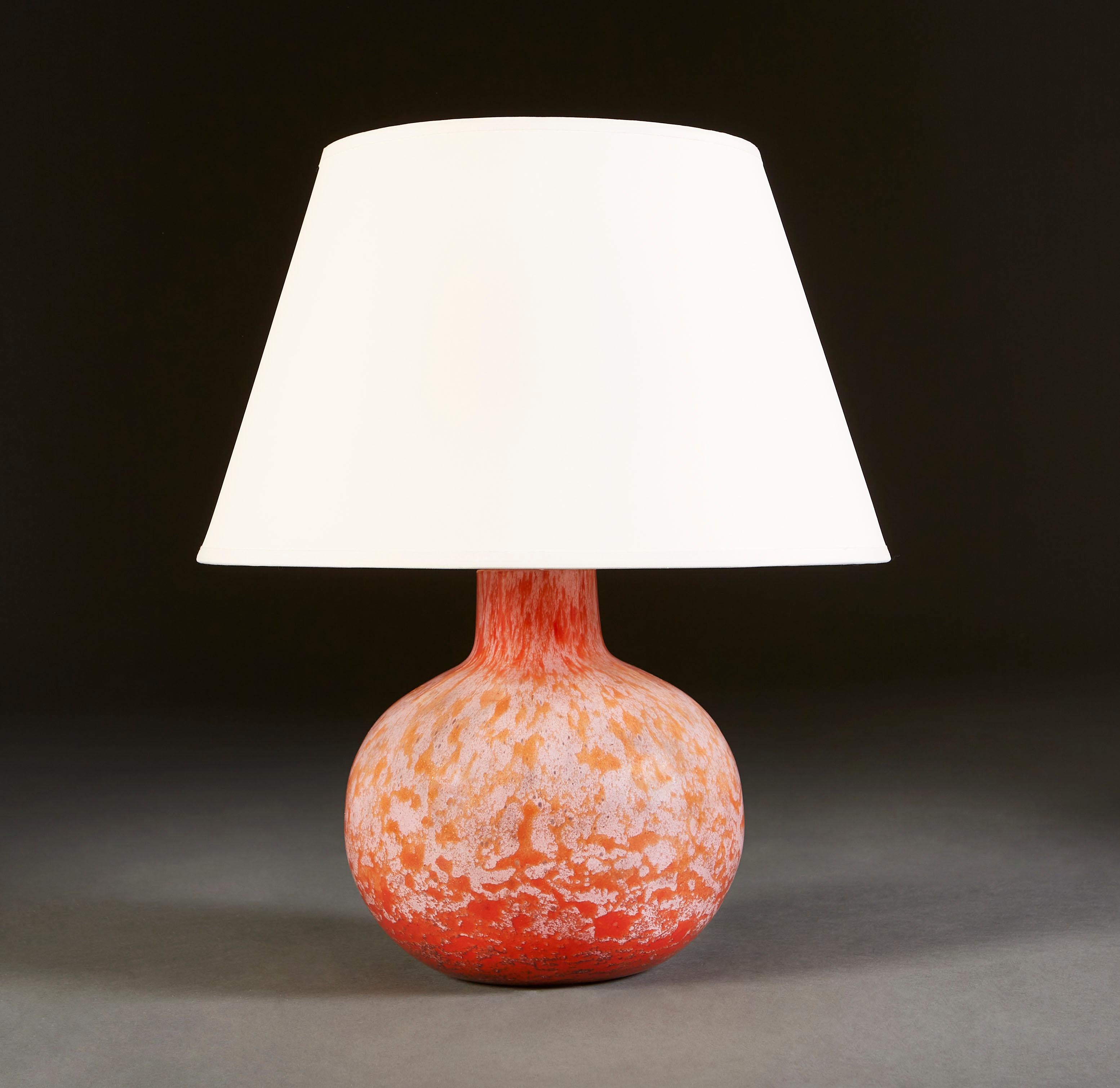 A mid century pink Murano glass lamp, of spherical form with narrowing cylindrical neck and crackled effect surface.

Currently wired for the UK.

Please note: Lampshade not included.