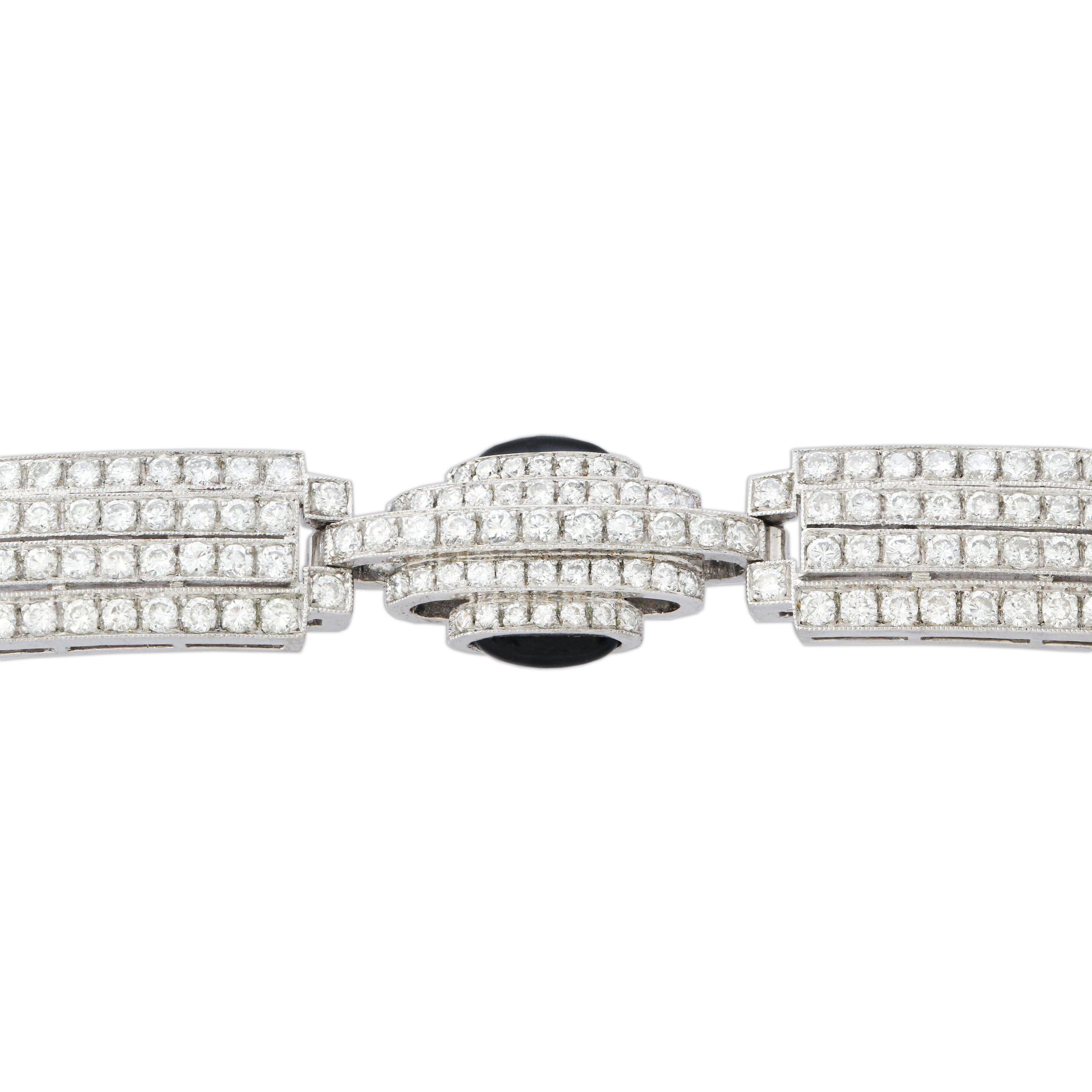 An onyx and diamond line bracelet formed of pavé-set diamond links with onyx details mounted in 18k white gold. Length = 17cm. Circa 1950s
