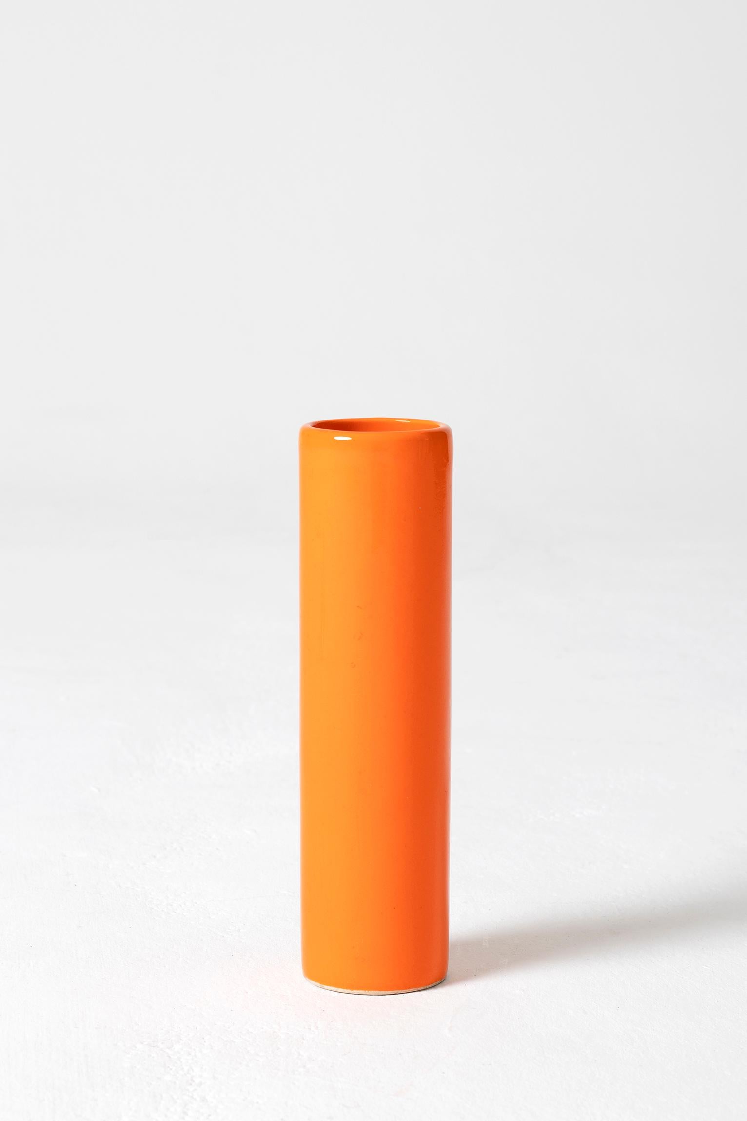 An orange ceramic Rouleau vase,
France, second half of the 20th century.