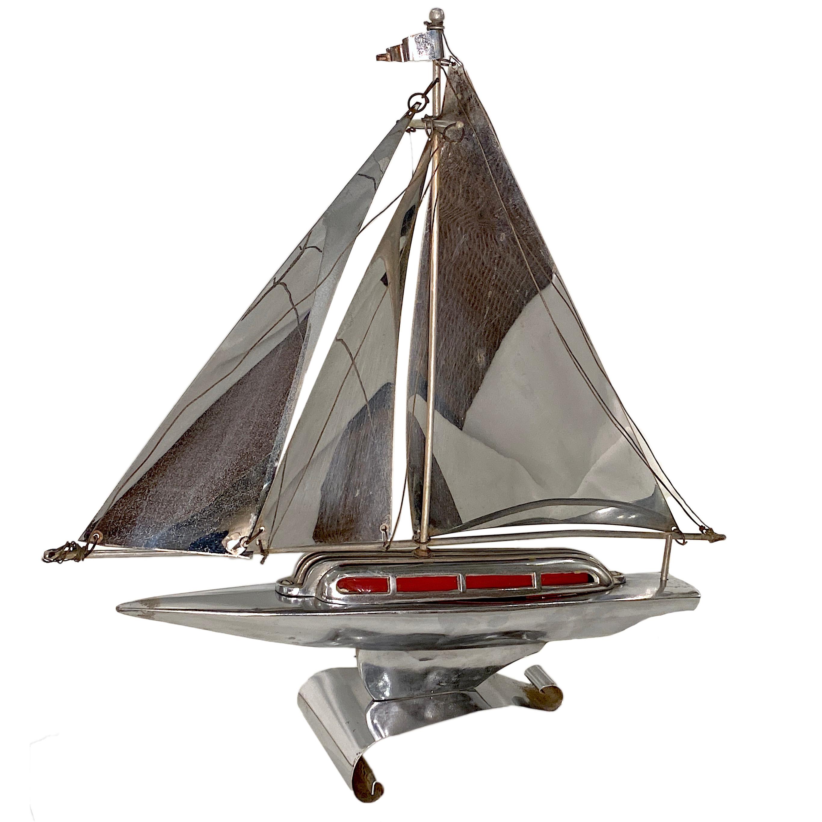 A circa 1960s English nickel-plated sailboat table lamp with an interior light.

Measurements:
Height 18
