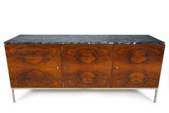 A Midcentury Sideboard with a Stainless Steel Base and Marble Top