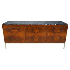 A Midcentury Sideboard with a Stainless Steel Base and Marble Top 