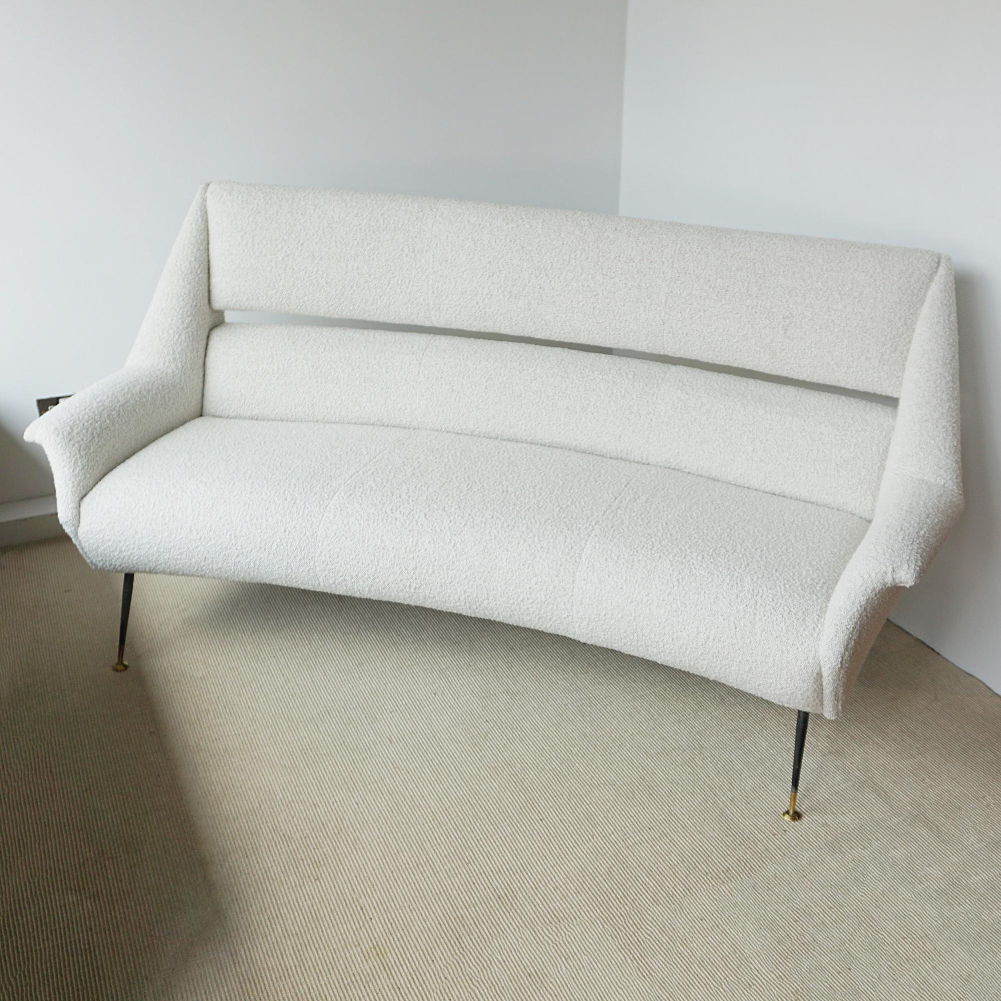 A Mid-Century sofa by Gigi Radice for Minotti. Re-upholstered in white boucle with original steel and brass capped feet. 

Dimensions: H 97cm W 178cm D 67cm Seat H 45cm

Origin: Italian

Date: Circa 1950

Item Number: 2706243

All of our furniture