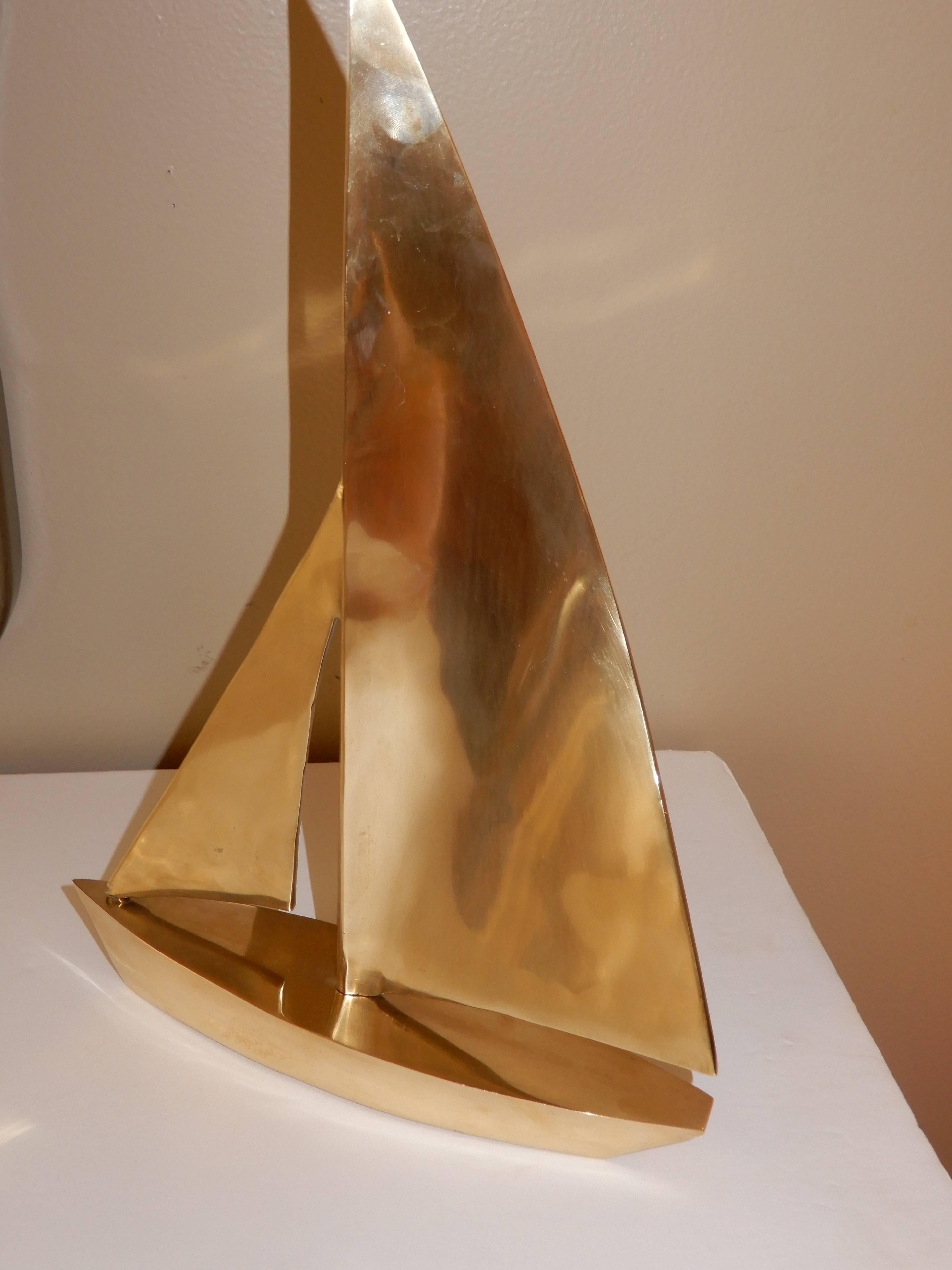 A well executed modern sailboat, fine craftsmanship, solid brass. The weight is 12 lbs.
 