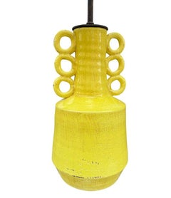 A mid century style yellow ceramic and bronze lamp with six handle design.