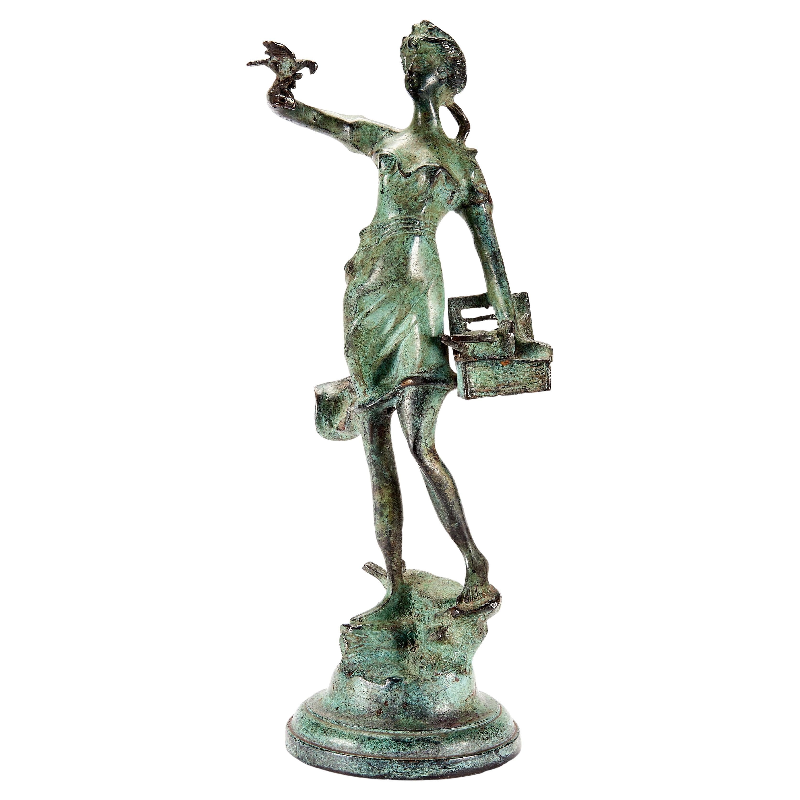 Mid-Century verdigris bronze figure of a girl releasing doves For Sale