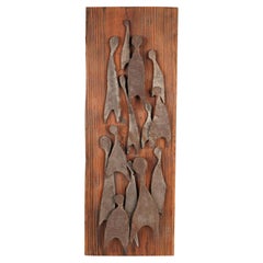 A mid century wood and iron wall hanging, circa 1960