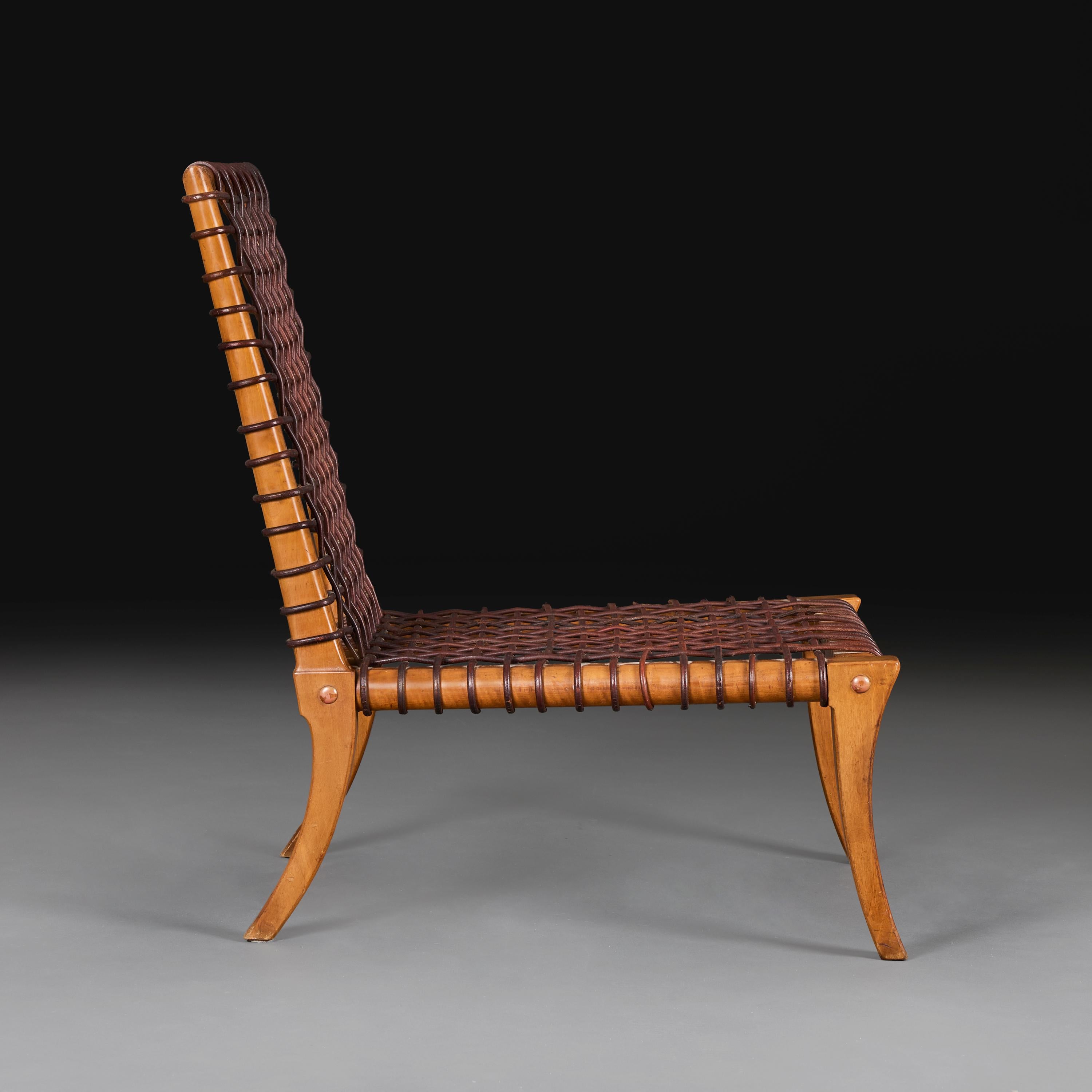 Mid-Century moderno Una sedia da salotto in pelle intrecciata di metà secolo di T.H. Robsjohn-Gibbings in vendita