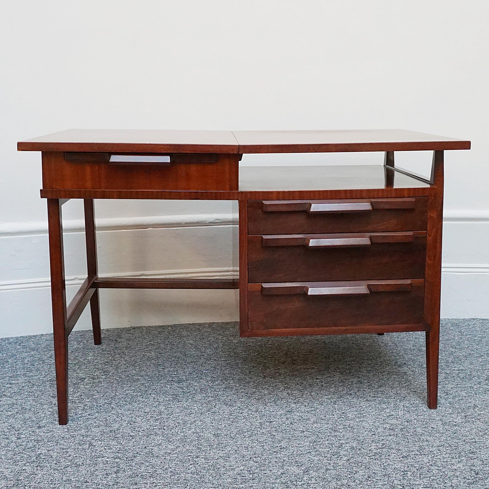 A Mid-Century writing desk. Mahogany and beech wood with three draws and lift up hinged top. Attributed to Gio Ponti.

Dimension: H 78cm W 120cm D 69cm

Origin: Italian

Date: 1950

Item Number: 0202245

Gio Ponti (1891-1979) was an influential