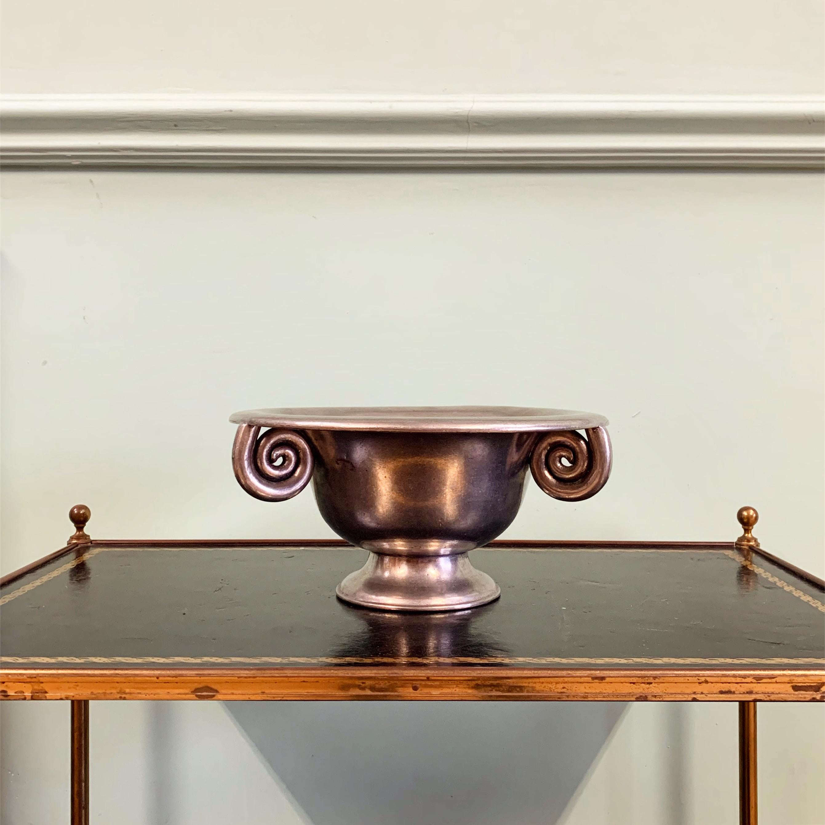 A contemporary pewter tazza of antique design with three scrolled handles - luscious colour and heavy weight.

Continental, Mid Twentieth Century

Inquire about this piece

H 12 x W 27 cms

