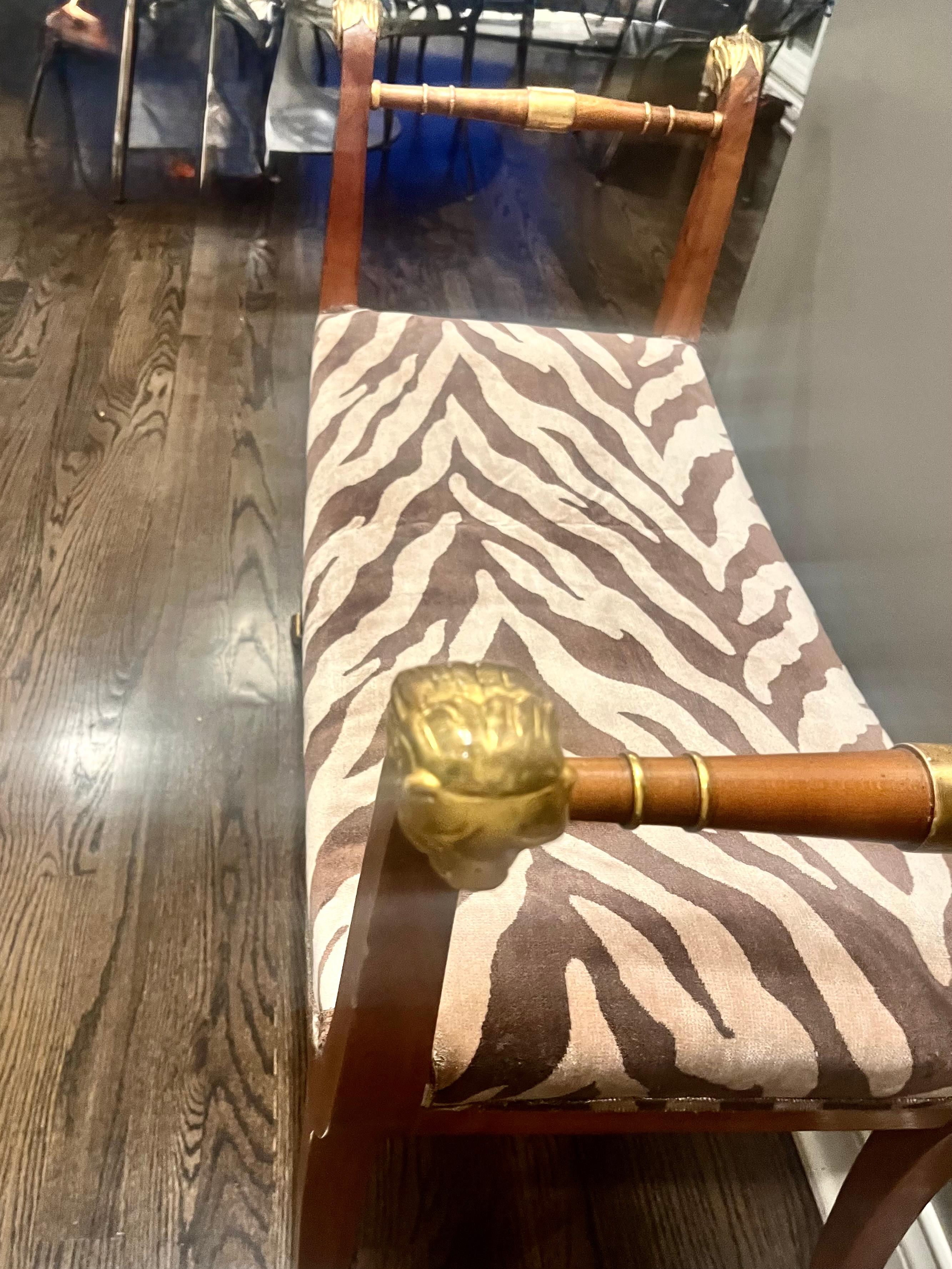 Sculpté A Mid Twentieth Century Empire style parcel gilt bench by Baker Furniture Co. en vente