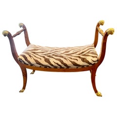 A Mid Twentieth Century Empire style parcel gilt bench by Baker Furniture Co.