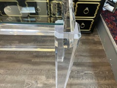 A Mid Twentieth Century glass inset Lucite console table