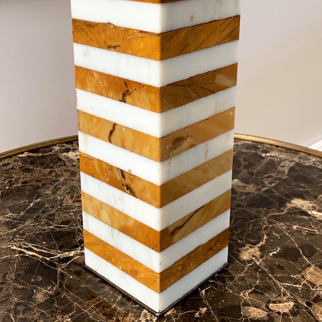 An incredibly chic lamp base of rectangular form banded with Carrara and Sienese marble. The marble of deep rich colour and substantially proportioned.

Italian, 1950s

Height listed to top of marble.