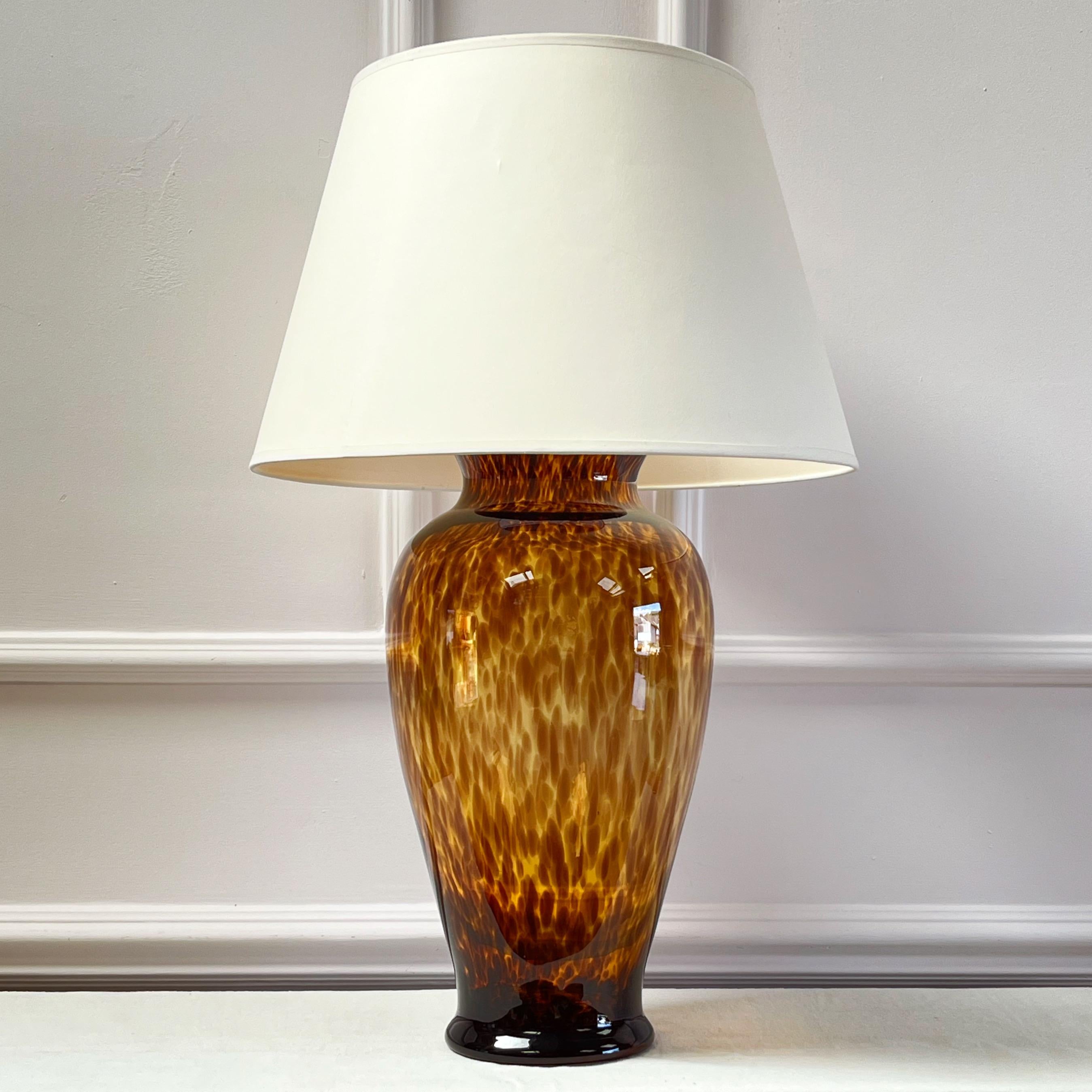 A very generously scaled Murano glass vase, tortoiseshell pattern with pinched neck and flared rim , mounted as a lamp.

This can be wired for international fittings inc of the listed price.

Italian, 1950s

H 60 ( to bulb holder) x W 24 x D 24 cms