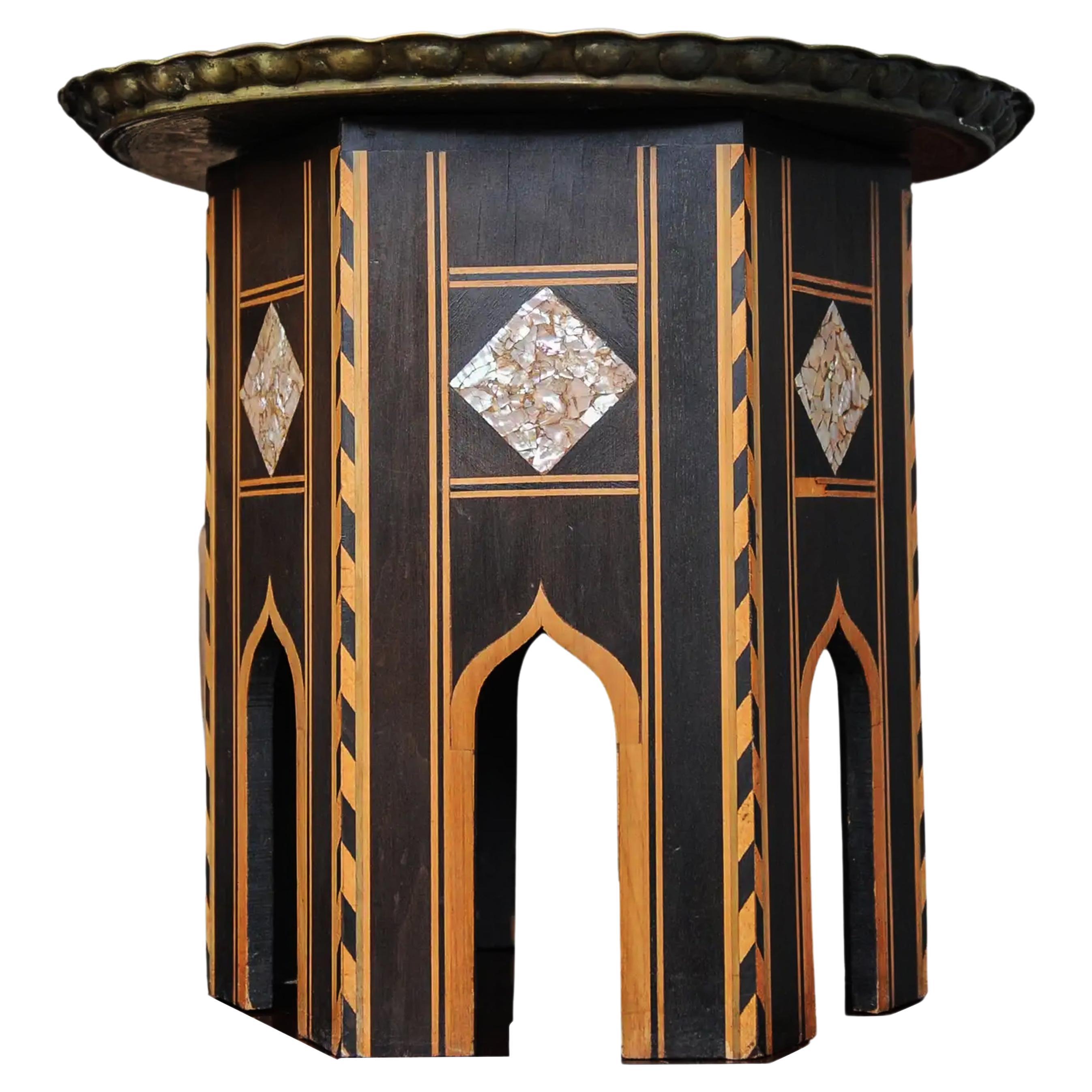 A Syrian Ebonised Tea Table With Removable Brass Decorative Pie Crust Edged Tray Top

Full Height 51cm
Base Width 41cm
Brass Tray Diameter 58cm