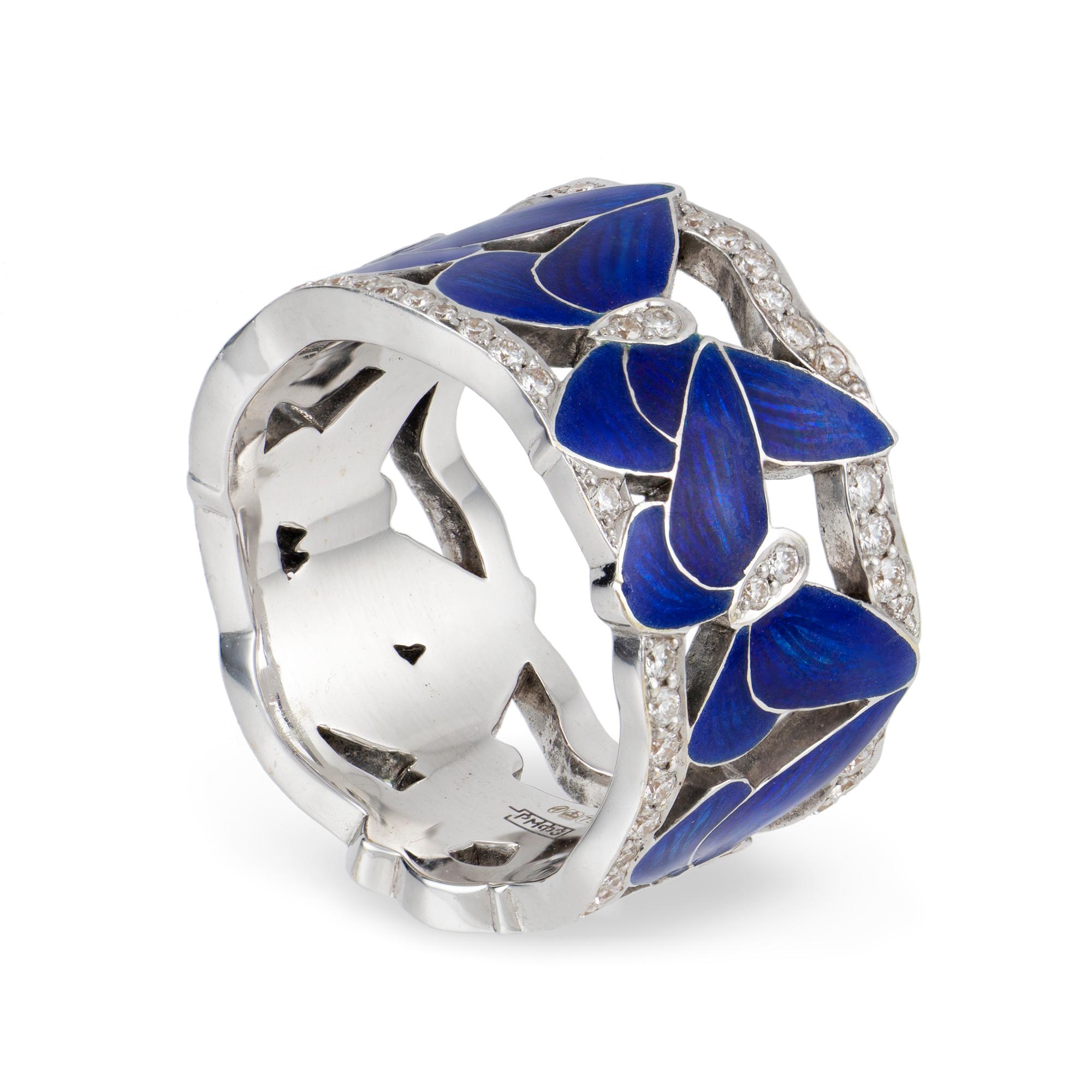 A midnight-blue butterfly ring by Ilgiz F, consisted of six butterflies with blue champlevé enamelled wings and diamond-encrusted bodies, to an openwork-design ring with diamond-set wavy boarders, the diamonds weighing 0.83 carats in total, all