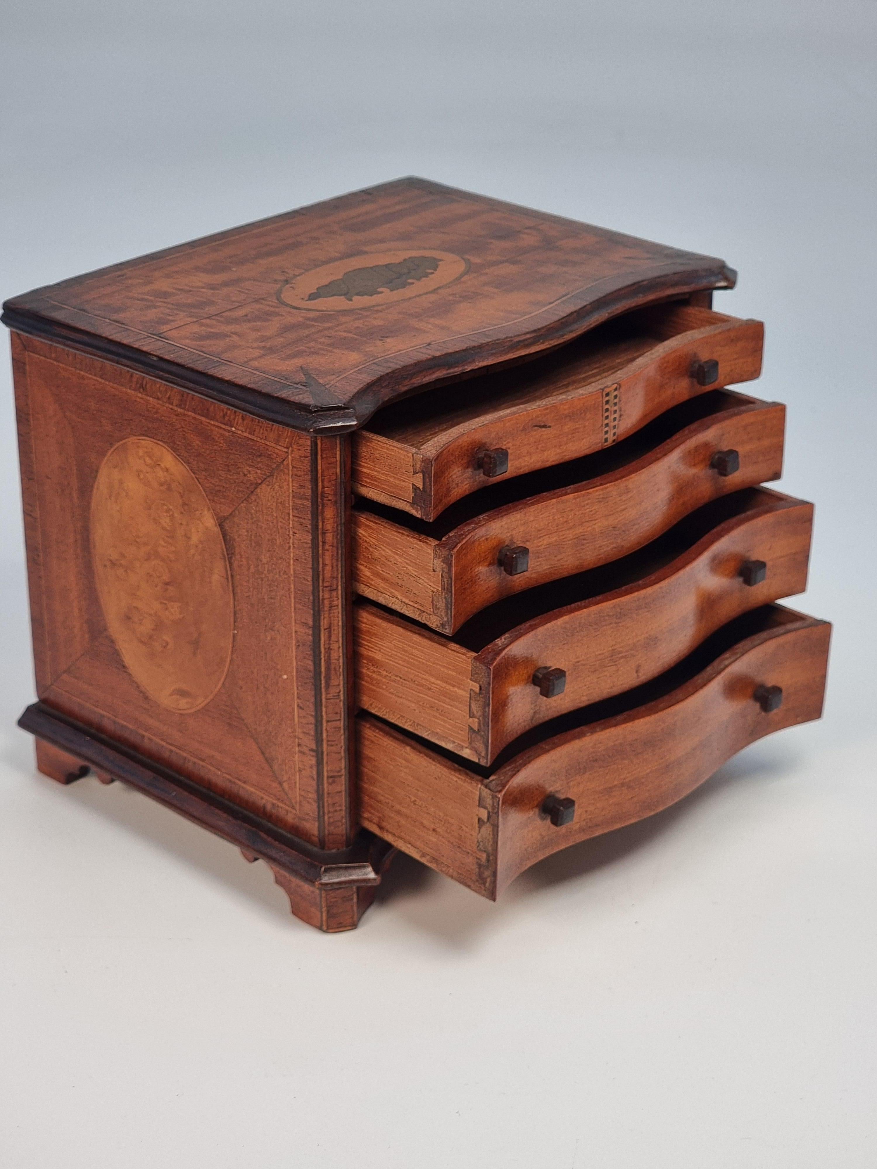 Early 20th Century A miniature 18th C style mahogany English serpentine chest of drawers 1907 For Sale