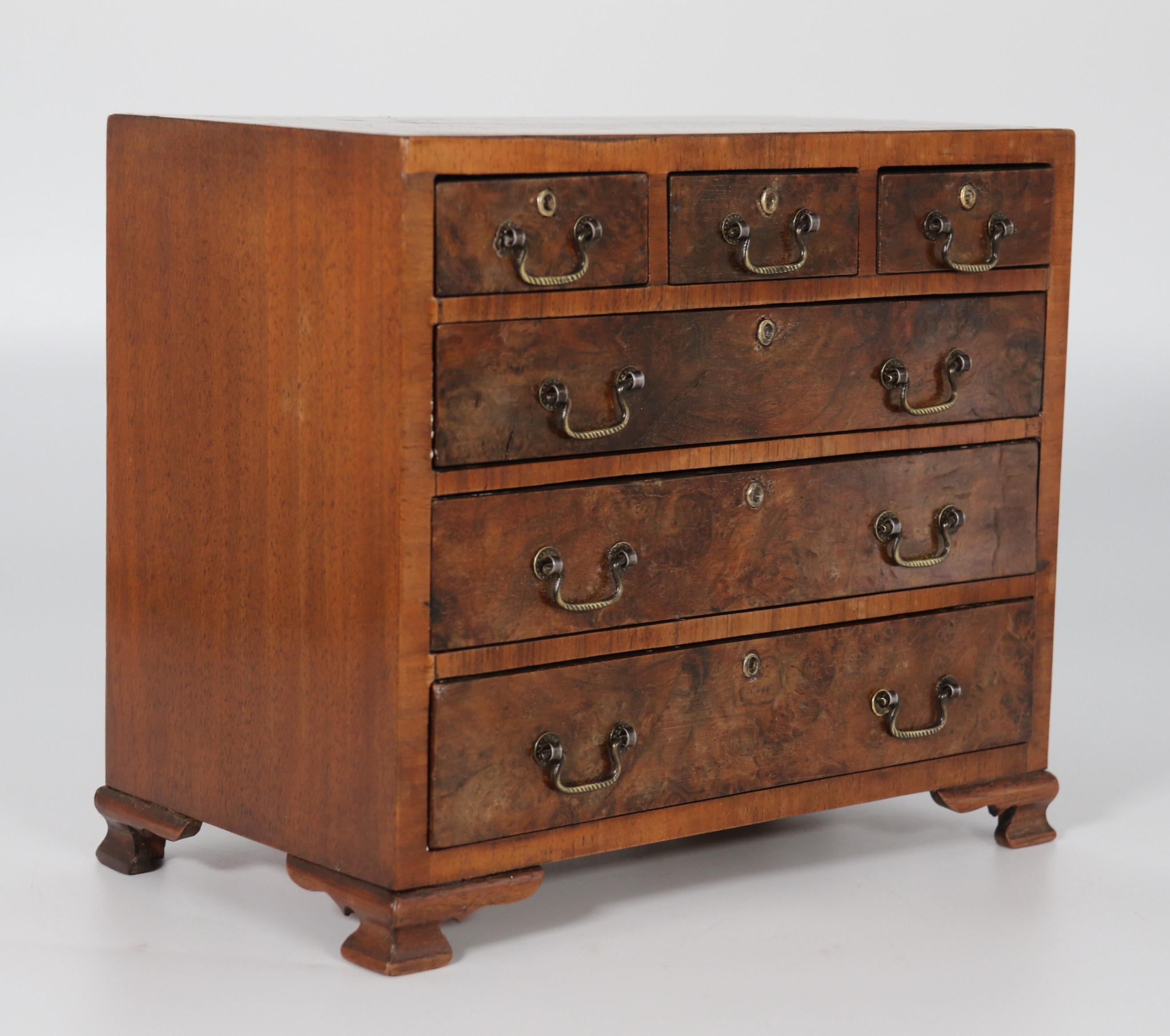 A miniature George II style figured walnut chest of drawers, English circa 1900 In Good Condition For Sale In Central England, GB