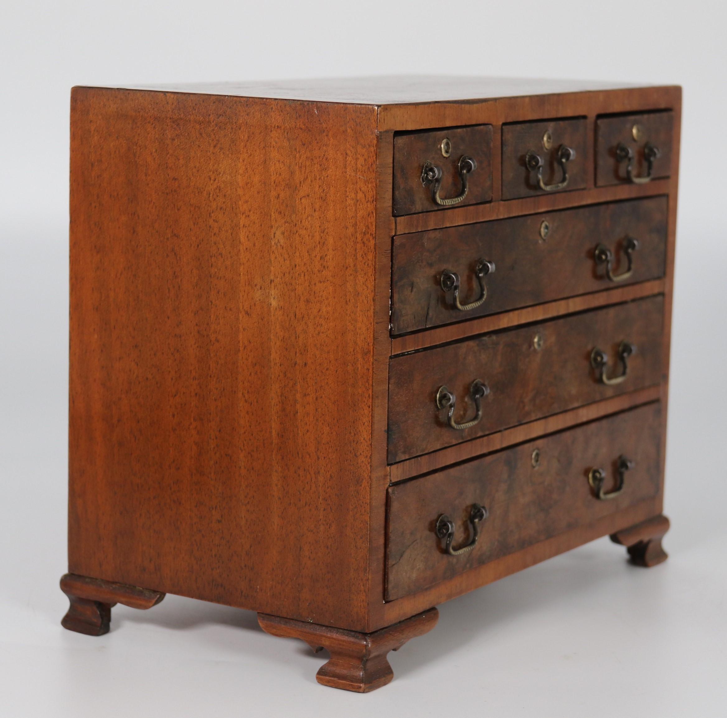 20th Century A miniature George II style figured walnut chest of drawers, English circa 1900 For Sale