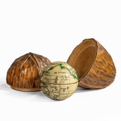 A miniature globe by Bauer in a carved ‘walnut’ case
