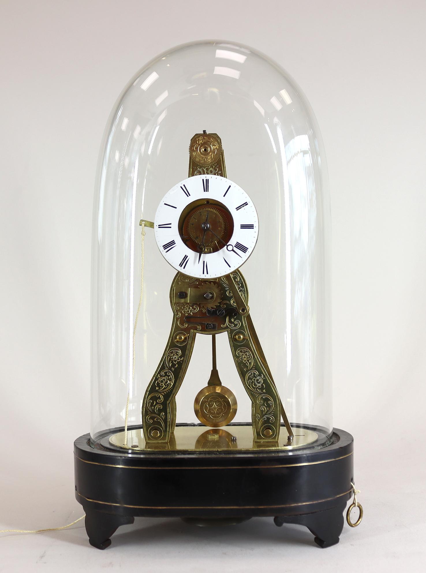 A miniature French skeleton alarm clock with silk suspension dating from the mid 19th century, with original glass dome on an ebonised and brass inlayed base with enamel dial, and silvered alarm dial, Striking on a very attractive bell, .

This