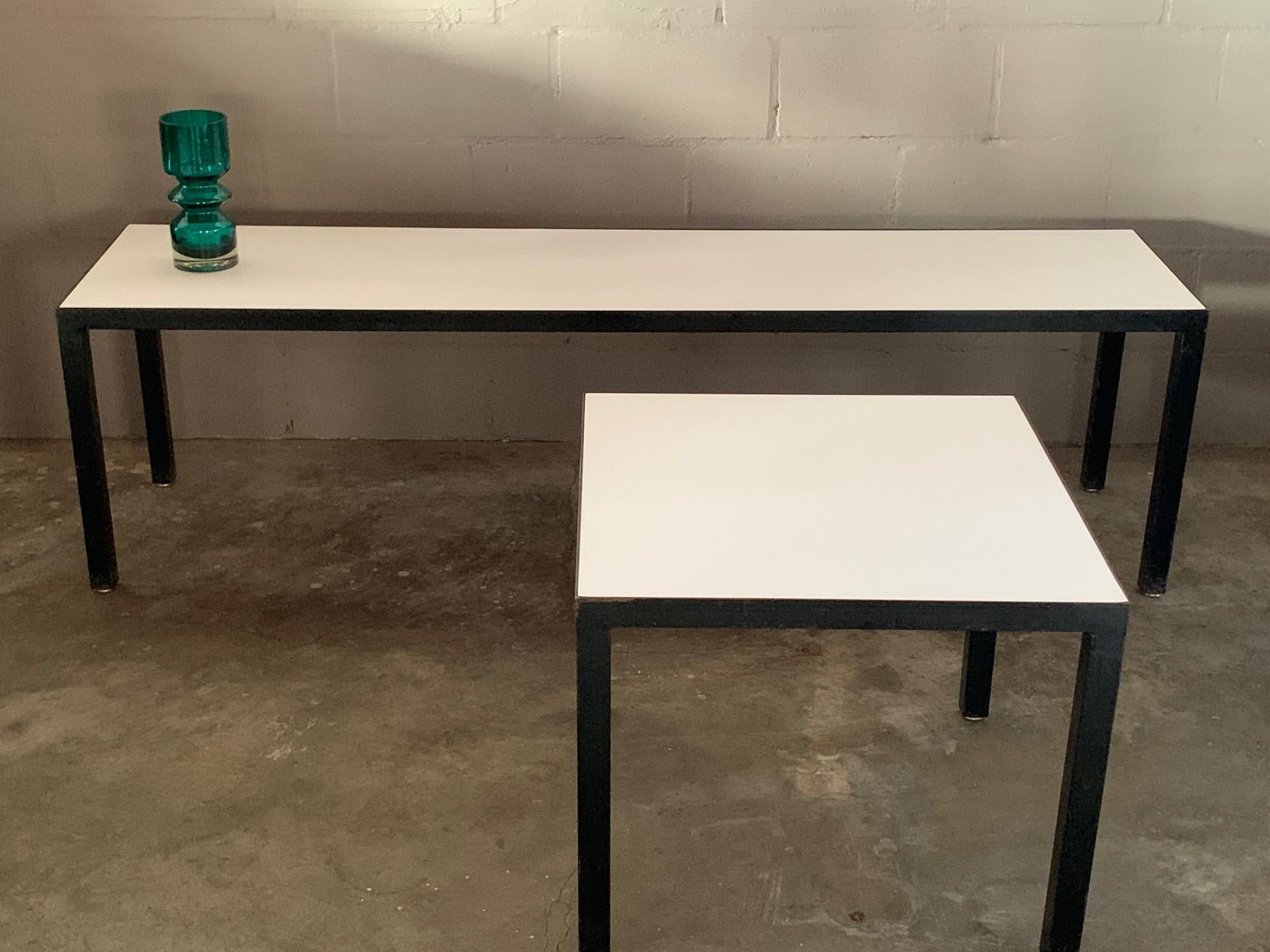A Classic, Minimalist bench or coffee table and matching side table by JG Furniture, NYC. Black steel with white Formica tops give it a simple and timeless look. The long table measures 18