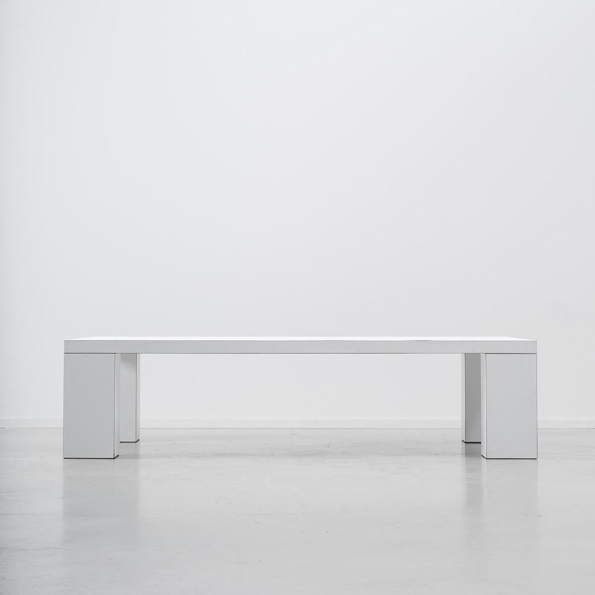 A striking piece of minimalism produced by Dutch company Metaform in the 1970s. Relying heavily on proportion and subtle detailing the table would be equally at home as a coffee table or a low console. The white laminate surface is ever so slightly