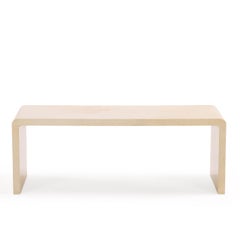 A Minimalist Parchment Waterfall Coffee Table.