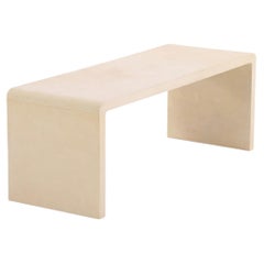 A Minimalist Parchment Waterfall Coffee Table.