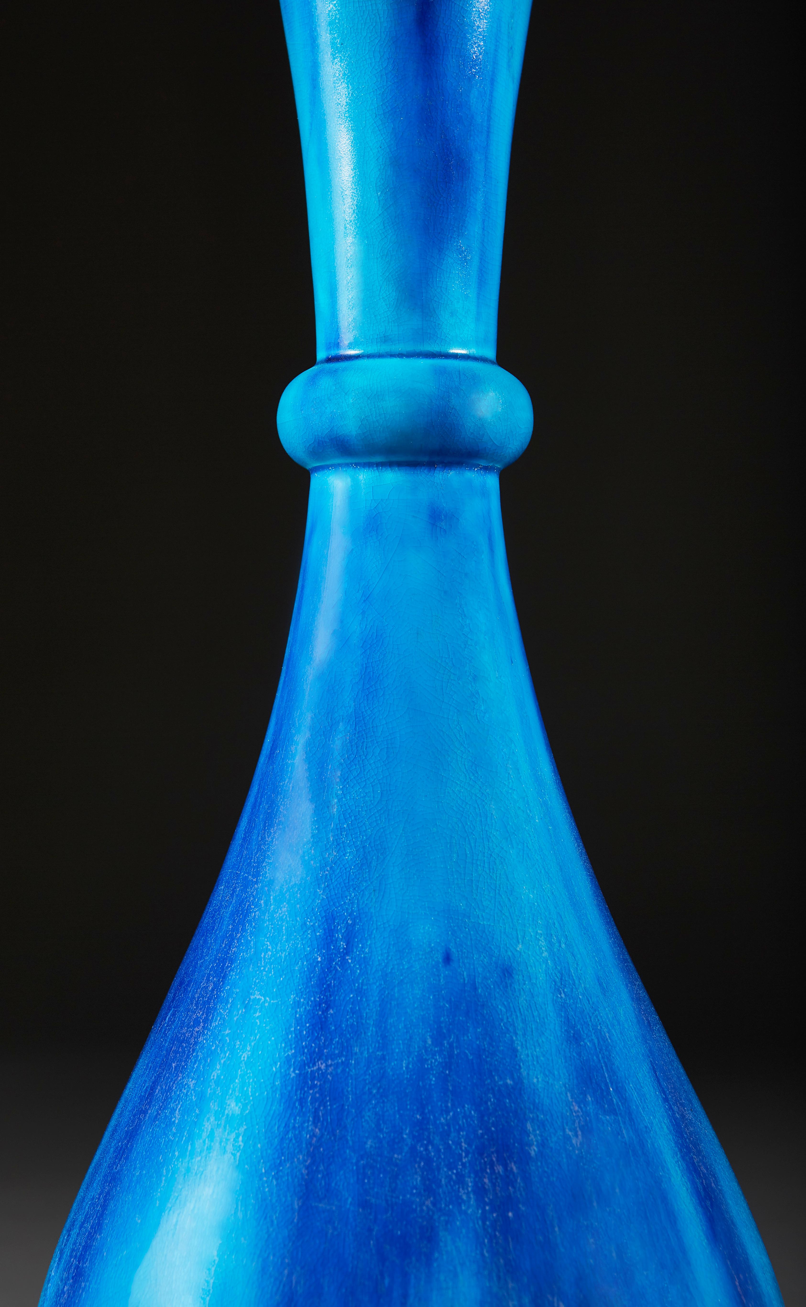 A twentieth century Minton bottle neck vase, with wonderful variegated blue glaze, now converted as a lamp.

Please note: Lampshade not included.

Currently wired for the UK.