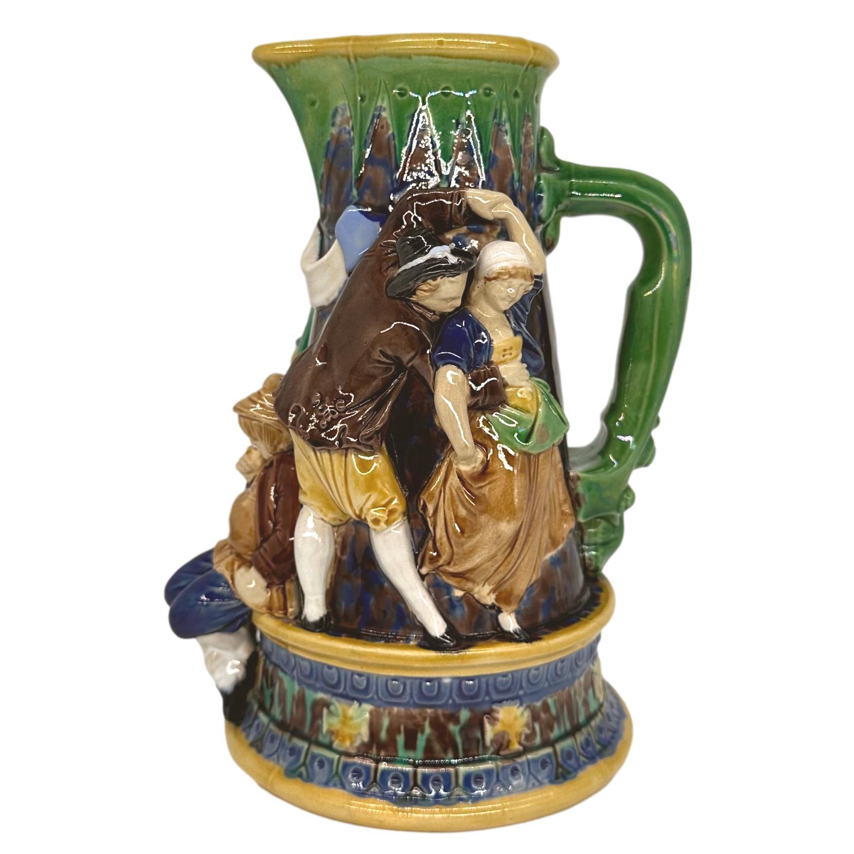 English A Minton Majolica Ale Jug with Five Revelers in Medieval Dress, dated 1862 For Sale