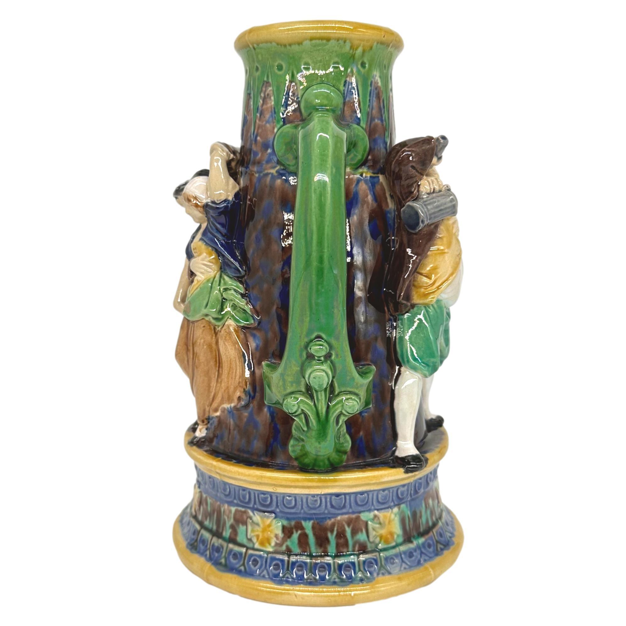 Molded A Minton Majolica Ale Jug with Five Revelers in Medieval Dress, dated 1862 For Sale