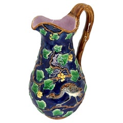 A Minton Majolica Cobalt-Ground Jug with Bird, Ivy, Berries, Dated 1865