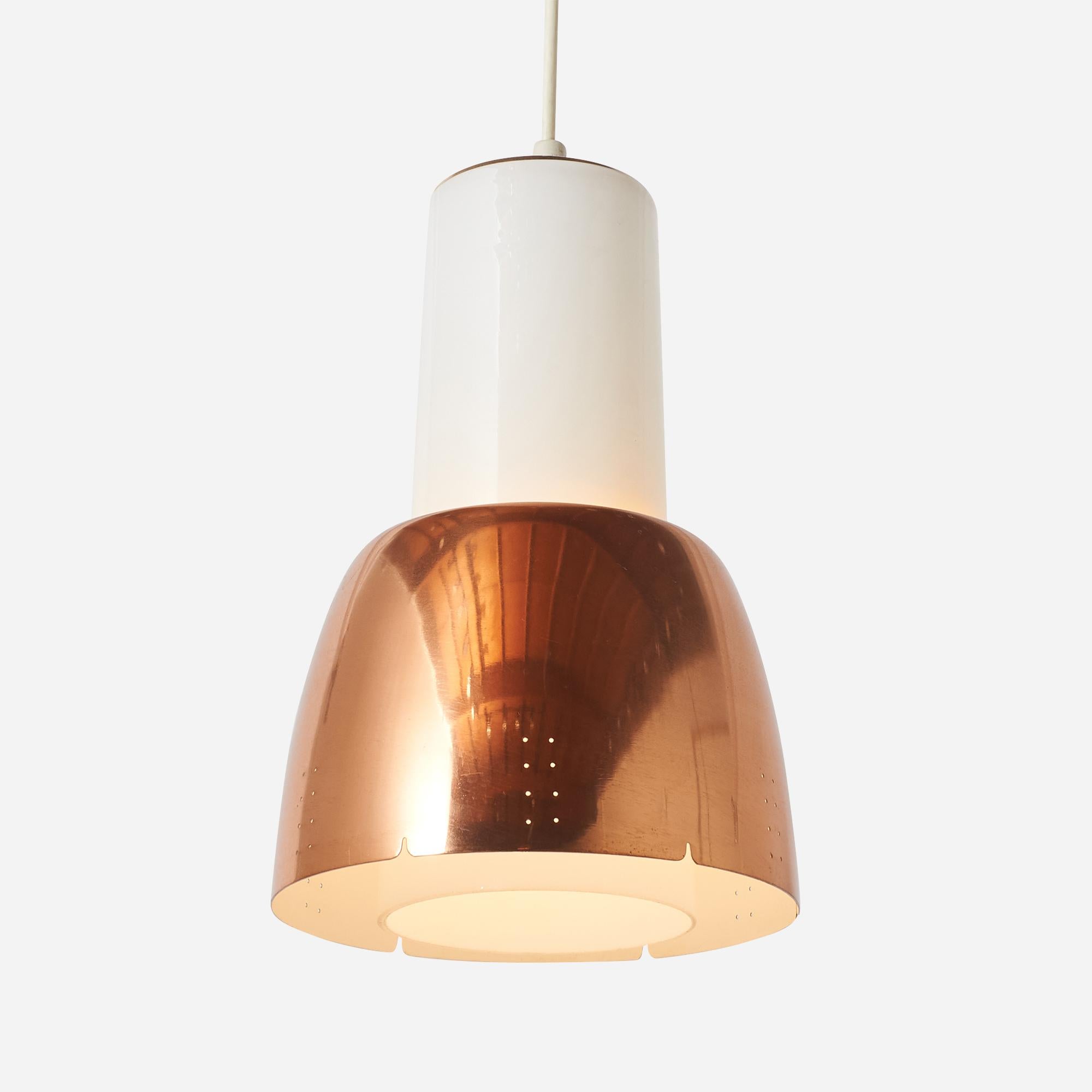 A model K2-16 pendant lamp by Paavo Tynell for Idman. The lamp has an opaline glass cylinder diffuser with an elegant copper shade with twin dot perforations. The lamp is marked by Idman and in good vintage condition.