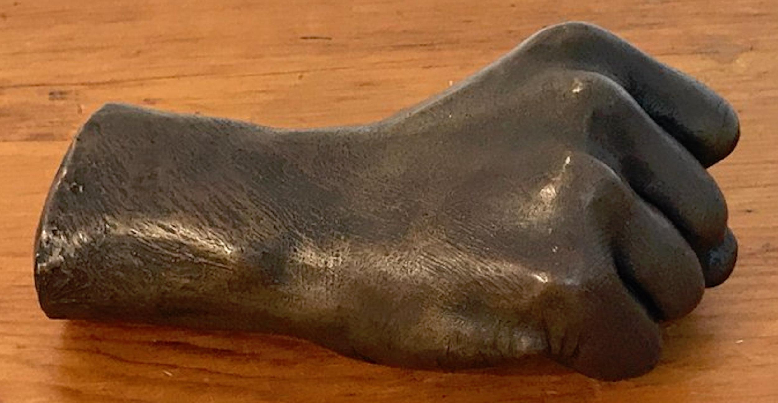 A model of a Human Fist in bronze, signed the Roman Bronze Works NY. Realistically cast and modeled, highly detailed. Artist unknown, possibly a life cast of Anna Hyatt Huntington, a variation of the known and documented example.