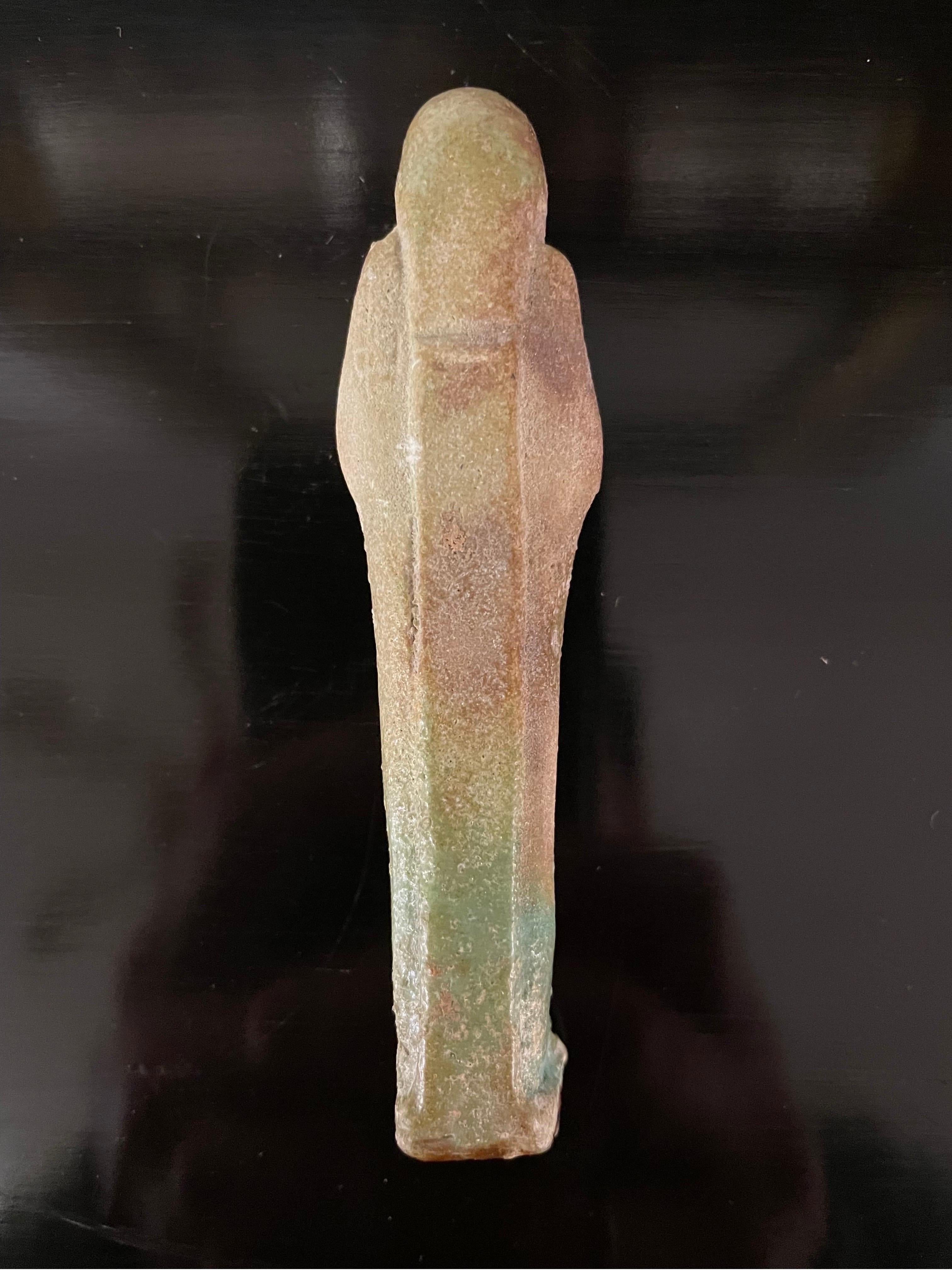 A modelled pale turquoise glazed Ushabti, Circa 26th Dynasty 664-525BC In Good Condition For Sale In ARMADALE, VIC